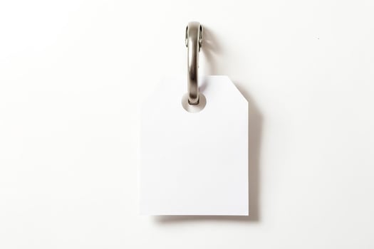 Blank White Tag Hanging on a Hook photo