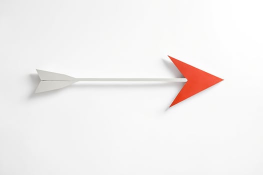 Red and White Arrow on White Background photo