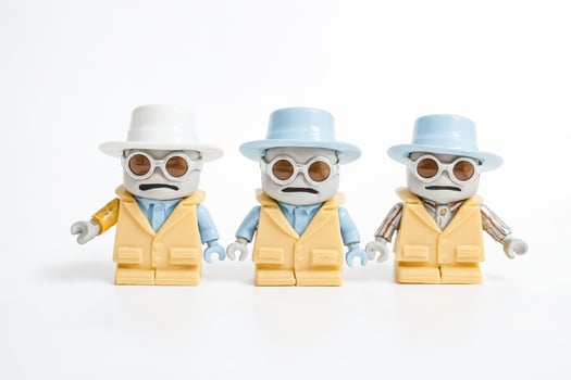 Three Toy Figures with Hats and Sunglasses photo