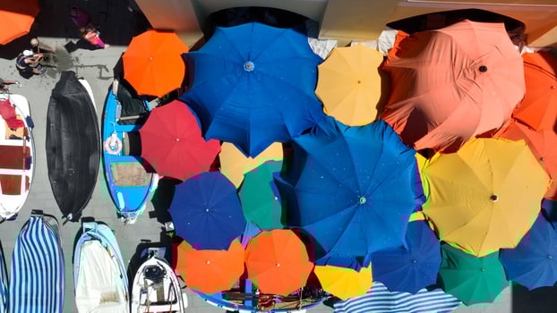 Aerial view of colorful umbrellas on Italian city street food market photo