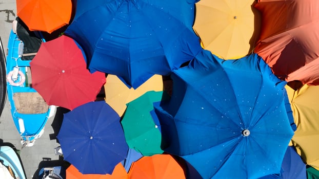 Aerial view of colorful umbrellas on Italian city street food market photo