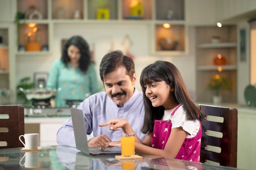 Dad Teaching Or Helping The Daughter To Use Laptop photo