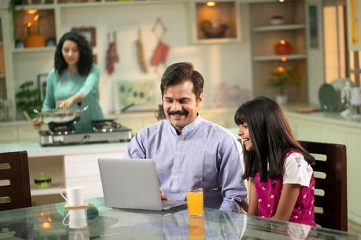 Father And Daughter Surfing On Internet On Laptop photo