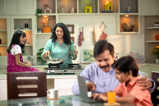 Mother Cooking In Kitchen With Daughter photo