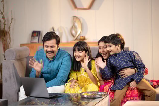 Father Mother And Son, Daughter Having Call With Relatives photo
