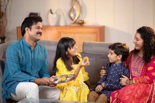 Little Boy Celebrating Raksha Bandhan Festival With Her Sister photo
