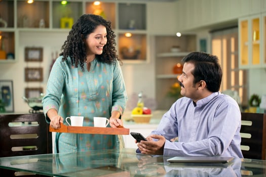 Romantic Cute Couple Sitting At Kitchen Table photo