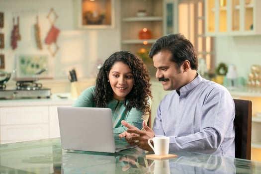 Husband And Wife Working Together At Home photo