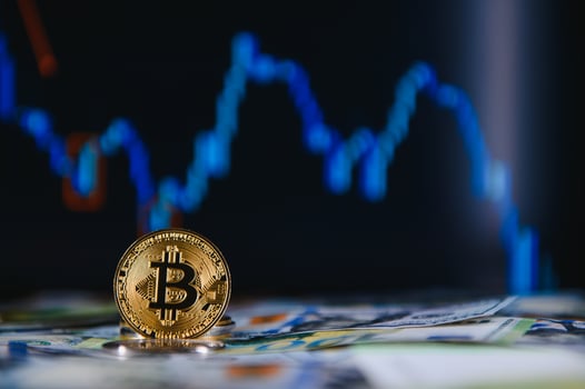 golden bitcoins new virtual currency with traditional dollars and euro as a background photo