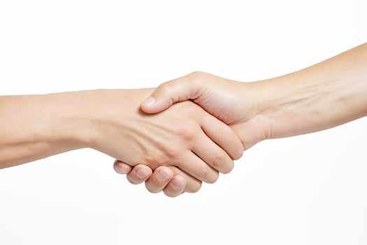 Close-up of Hands Shaking on a White Background photo