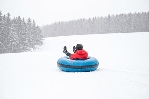 Snow tubing on a snowy day photo
