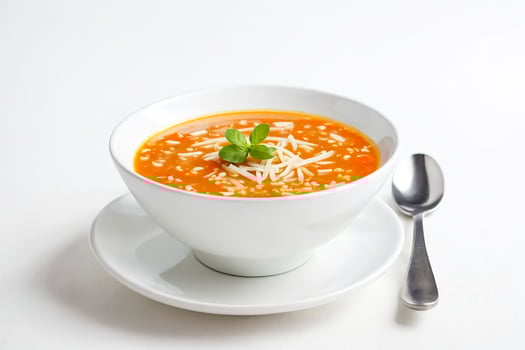 Close-Up of Tomato Soup with Rice and Cheese photo
