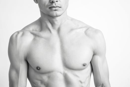 Black and White Image of a Man's Upper Body photo