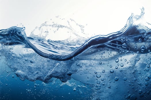 realistic blue water wave with bubbles on white photo