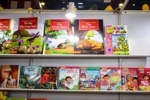 New Delhi, India, June 25 2024 - Variety of Books on shelf inside a book-stall at Delhi International Book Fair, Selection of books on display in Annual Book Fair at Bharat Mandapam complex photo