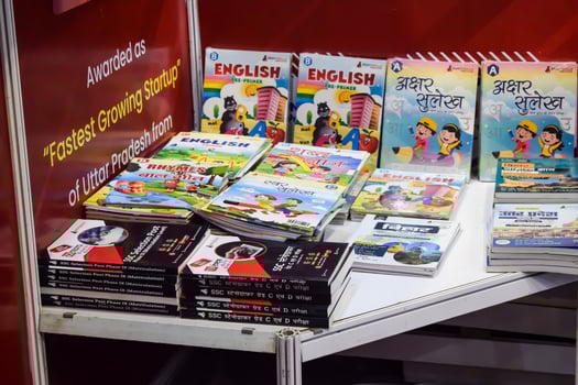 New Delhi, India, June 25 2024 - Variety of Books on shelf inside a book-stall at Delhi International Book Fair, Selection of books on display in Annual Book Fair at Bharat Mandapam complex photo