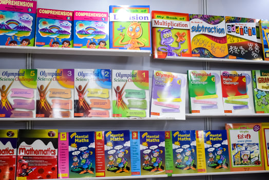 New Delhi, India, June 25 2024 - Variety of Books on shelf inside a book-stall at Delhi International Book Fair, Selection of books on display in Annual Book Fair at Bharat Mandapam complex photo