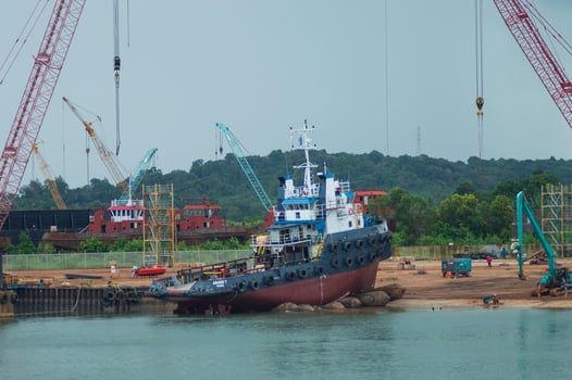 Batam, Indonesia. June 29, 2024. the process of raising the tugboat to the docx where maintenance will be carried out photo