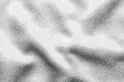 Golden shiny texture of silk satin satin with folds. photo