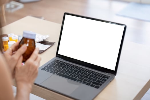 Elderly woman sit at home having online consultation with doctor on computer laptop, sick senior talk on call consulting with nurse using laptop, healthcare concept photo