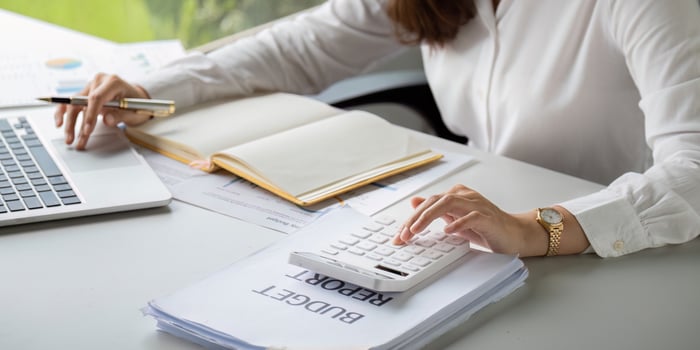 Interest rate and dividend concept businesspeople is calculating income and return on investment in percentage. income return retirement compensation fund, investment dividend tax stock market photo