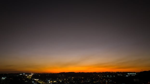 Curitiba in Parana, Brazil. Aerial View. Wonderful sunset with views of buildings and Tangua Park. Lake with reflection. photo