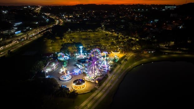 Curitiba in Parana, Brazil. Aerial View. Wonderful sunset with views of buildings and Tangua Park. Lake with reflection. photo