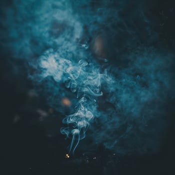 blue smoke on a black background photo