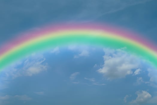 Clear Blue Sky with Vibrant Rainbow - Professional Stock Photo