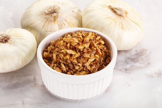 Dried roasted onion flakes for culinary photo