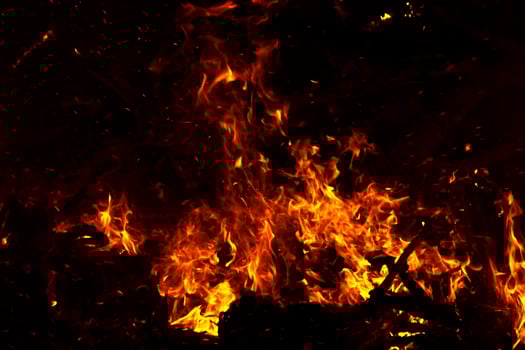 The movement of the flames in the dark photo