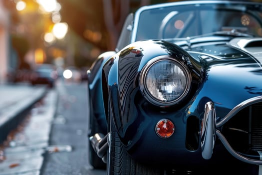 Classic blue american sports car parked on city street photo