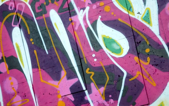 Colorful background of graffiti painting artwork with bright aerosol outlines on wall. Old school street art piece made with aerosol spray paint cans. Contemporary youth culture photo