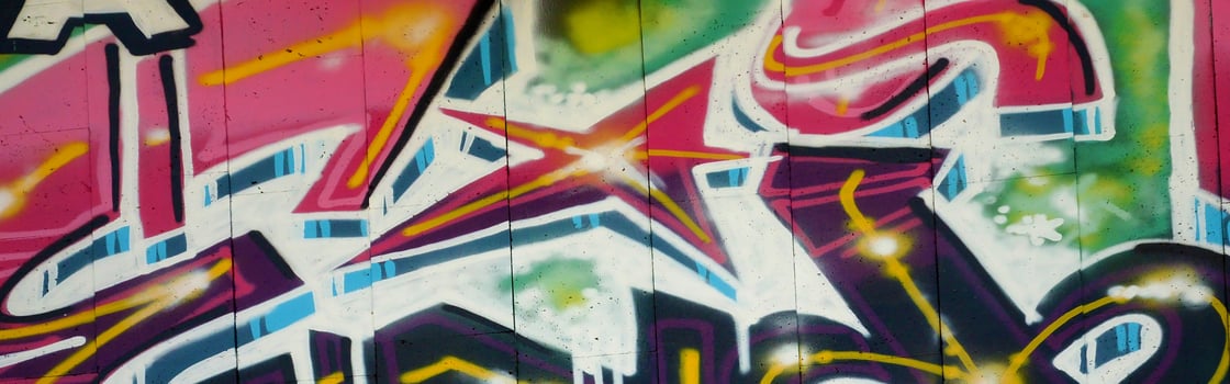 Colorful background of graffiti painting artwork with bright aerosol outlines on wall. Old school street art piece made with aerosol spray paint cans. Contemporary youth culture photo