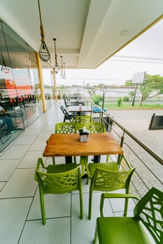 Empty outdoor restaurant tables photo