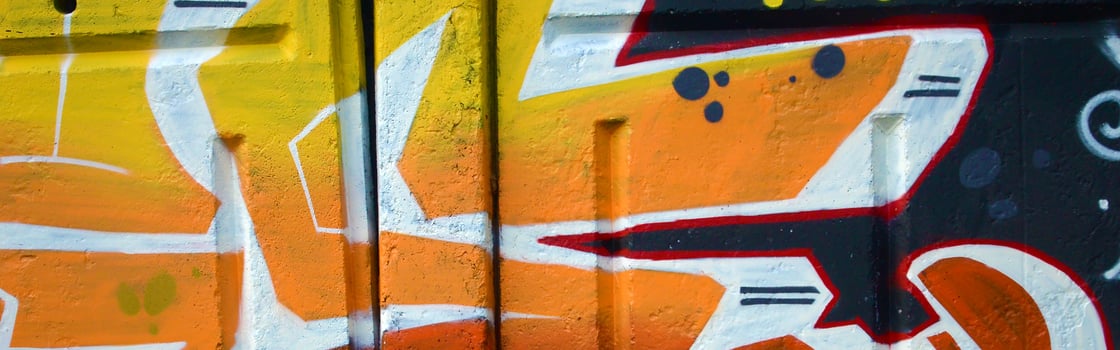Colorful background of graffiti painting artwork with bright aerosol outlines on wall. Old school street art piece made with aerosol spray paint cans. Contemporary youth culture photo
