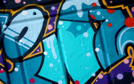 Colorful background of graffiti painting artwork with bright aerosol outlines on wall. Old school street art piece made with aerosol spray paint cans. Contemporary youth culture photo