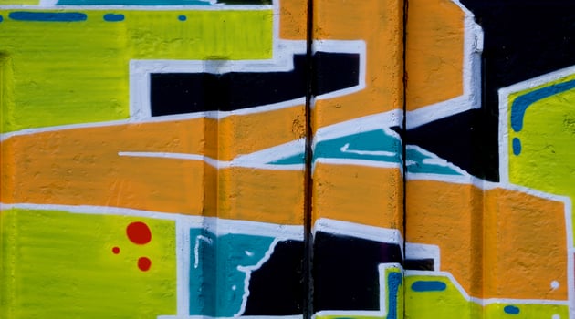 Colorful background of graffiti painting artwork with bright aerosol outlines on wall. Old school street art piece made with aerosol spray paint cans. Contemporary youth culture photo