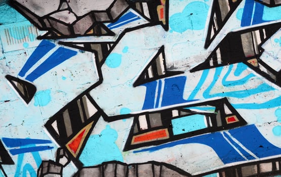 Colorful background of graffiti painting artwork with bright aerosol outlines on wall. Old school street art piece made with aerosol spray paint cans. Contemporary youth culture photo