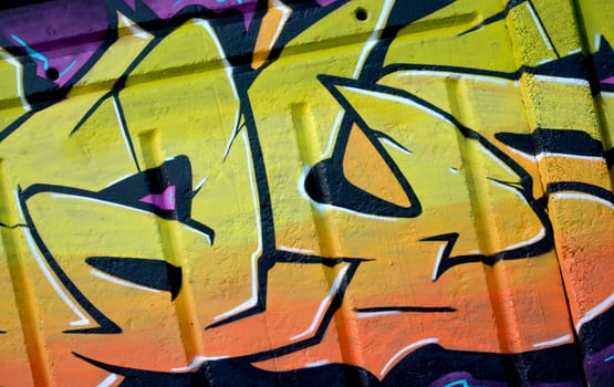 Colorful background of graffiti painting artwork with bright aerosol outlines on wall. Old school street art piece made with aerosol spray paint cans. Contemporary youth culture photo