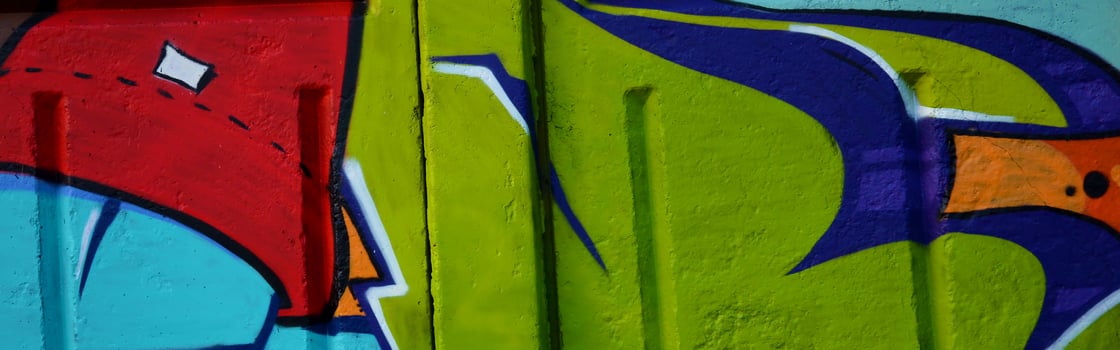 Colorful background of graffiti painting artwork with bright aerosol outlines on wall. Old school street art piece made with aerosol spray paint cans. Contemporary youth culture photo