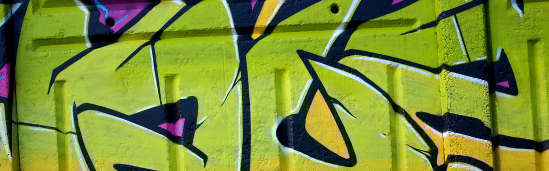 Colorful background of graffiti painting artwork with bright aerosol outlines on wall. Old school street art piece made with aerosol spray paint cans. Contemporary youth culture photo