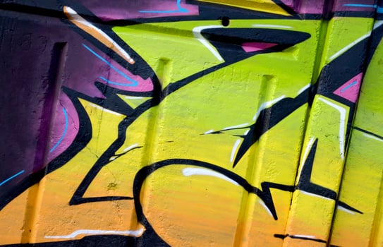 Colorful background of graffiti painting artwork with bright aerosol outlines on wall. Old school street art piece made with aerosol spray paint cans. Contemporary youth culture photo