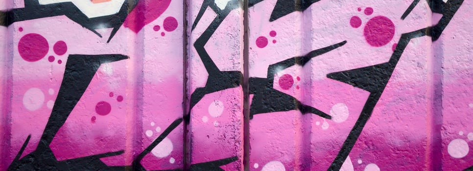 Colorful background of graffiti painting artwork with bright aerosol outlines on wall. Old school street art piece made with aerosol spray paint cans. Contemporary youth culture photo