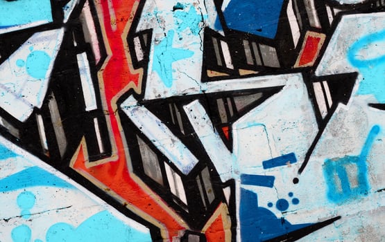 Colorful background of graffiti painting artwork with bright aerosol outlines on wall. Old school street art piece made with aerosol spray paint cans. Contemporary youth culture photo