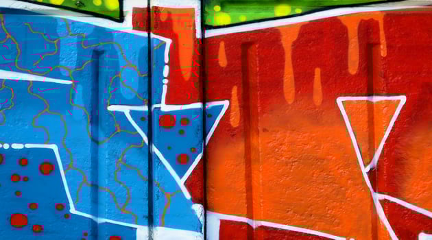 Colorful background of graffiti painting artwork with bright aerosol outlines on wall. Old school street art piece made with aerosol spray paint cans. Contemporary youth culture photo