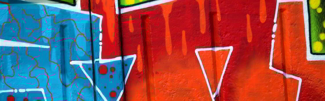 Colorful background of graffiti painting artwork with bright aerosol outlines on wall. Old school street art piece made with aerosol spray paint cans. Contemporary youth culture photo