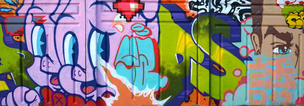 Colorful background of graffiti painting artwork with bright aerosol outlines on wall. Old school street art piece made with aerosol spray paint cans. Contemporary youth culture photo