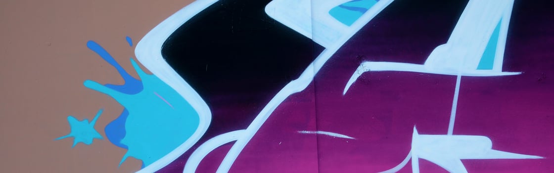 Colorful background of graffiti painting artwork with bright aerosol outlines on wall. Old school street art piece made with aerosol spray paint cans. Contemporary youth culture photo