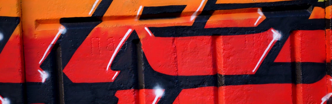 Colorful background of graffiti painting artwork with bright aerosol outlines on wall. Old school street art piece made with aerosol spray paint cans. Contemporary youth culture photo